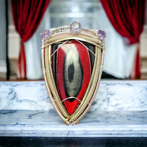 A Knights Tale Sterling silver wire wrapped fordite from a guitar shop